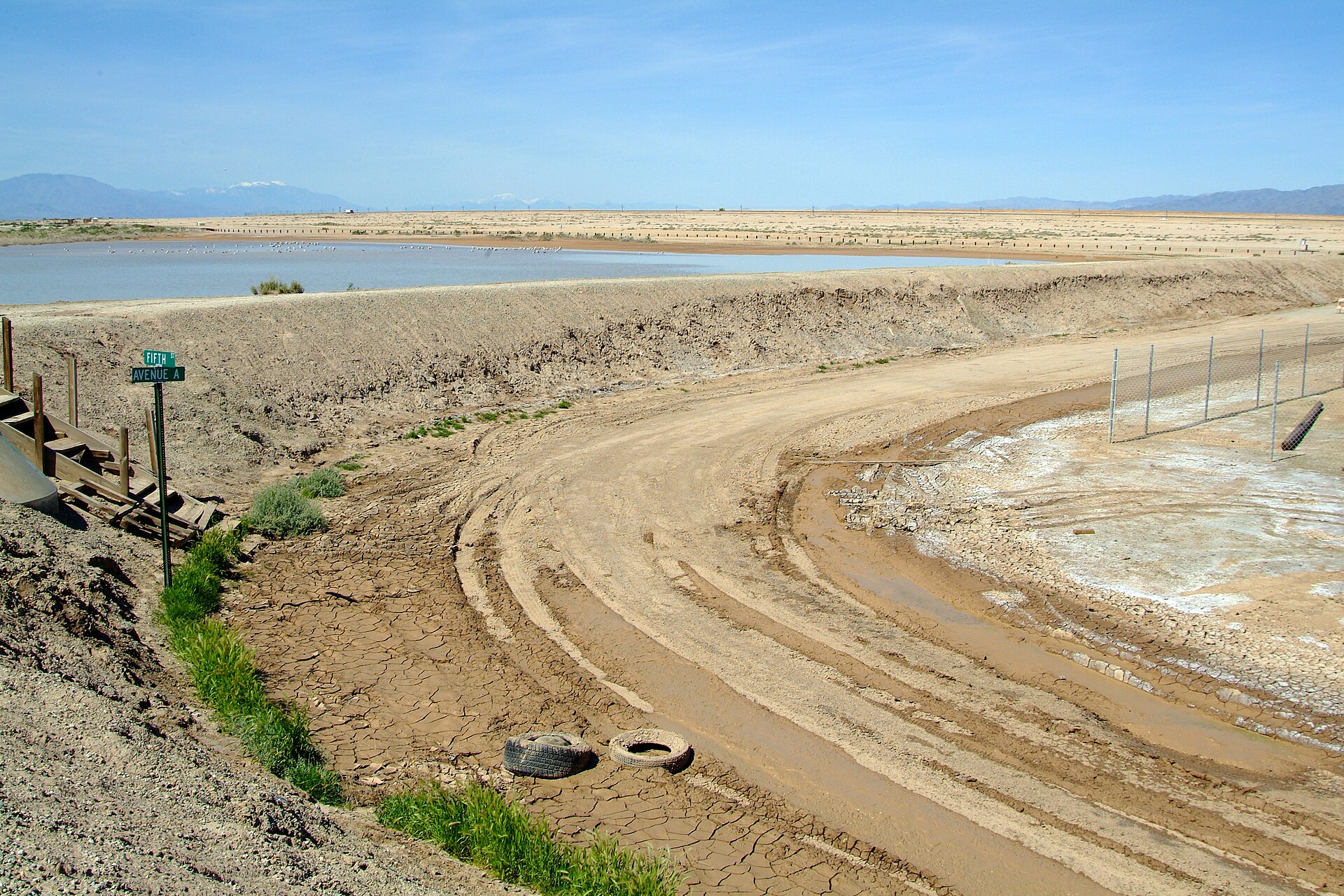 The earthen levee protecting the inland grid of Bombay Beach from the Salton Sea.