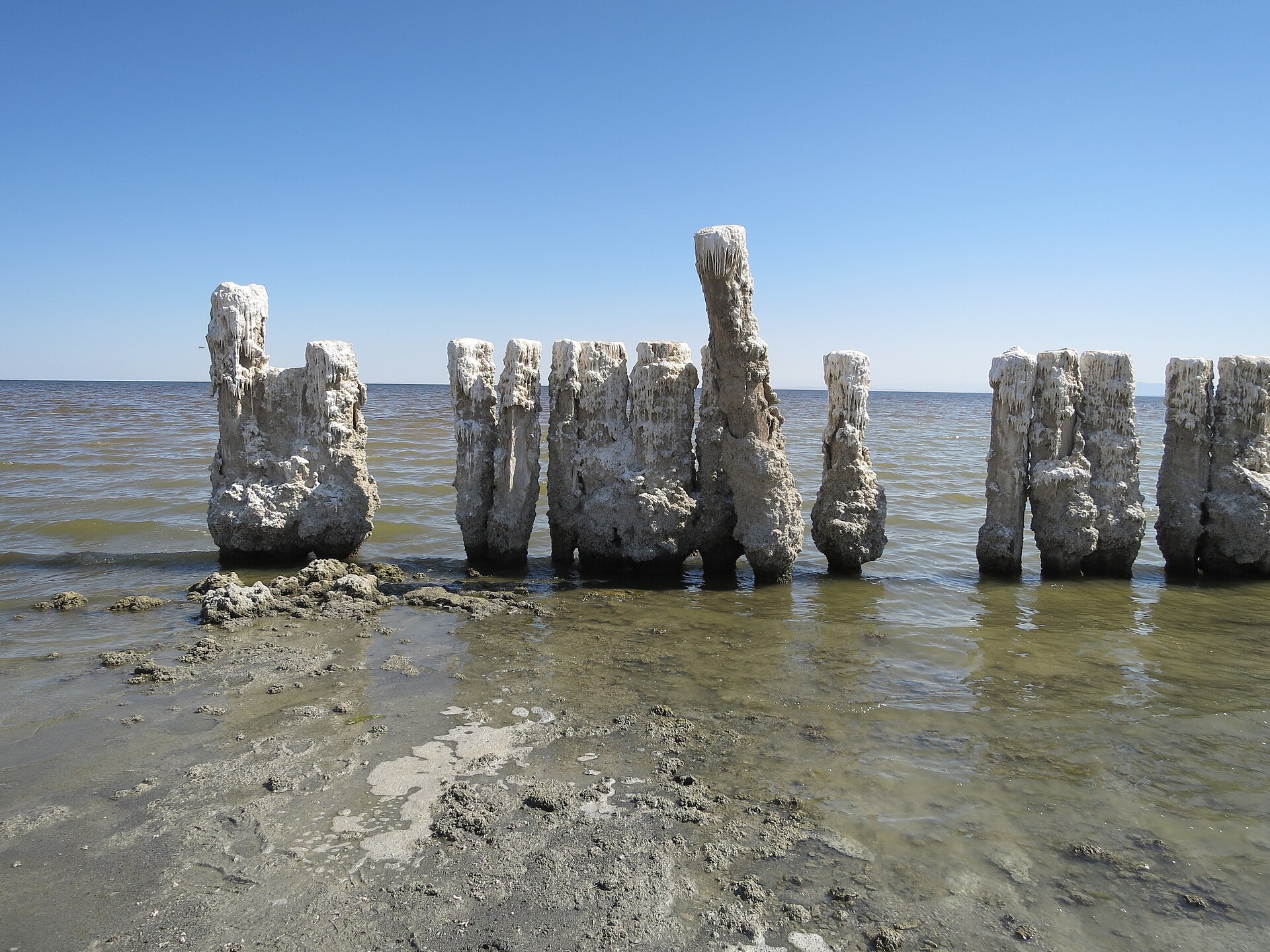 Salt-encrusted pilings and ruins at the edge of the Salton Sea at Bombay Beach.