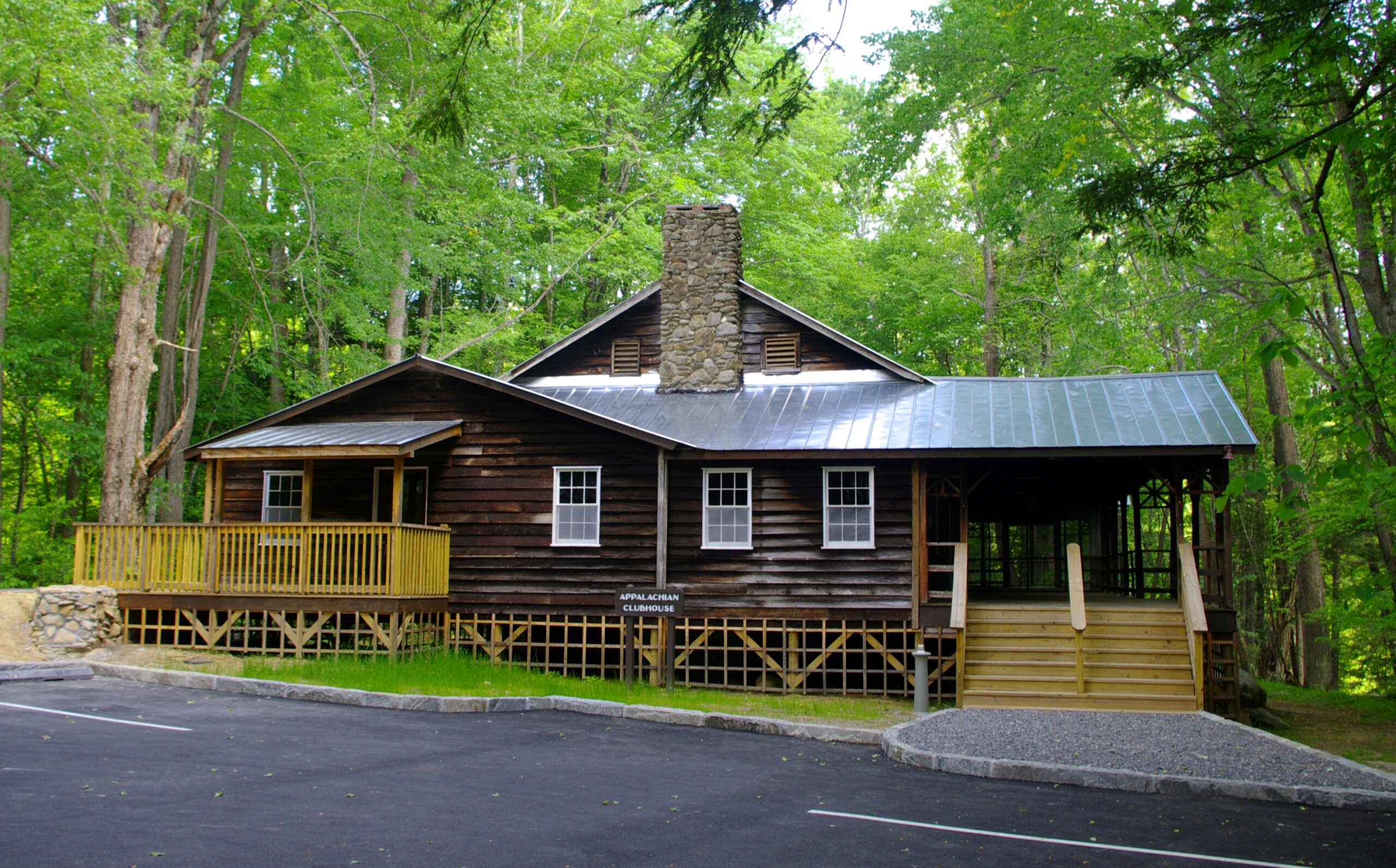 The historic Appalachian Clubhouse at Elkmont, Tennessee, a large rustic clubhouse building set among trees in Great Smoky Mountains National Park