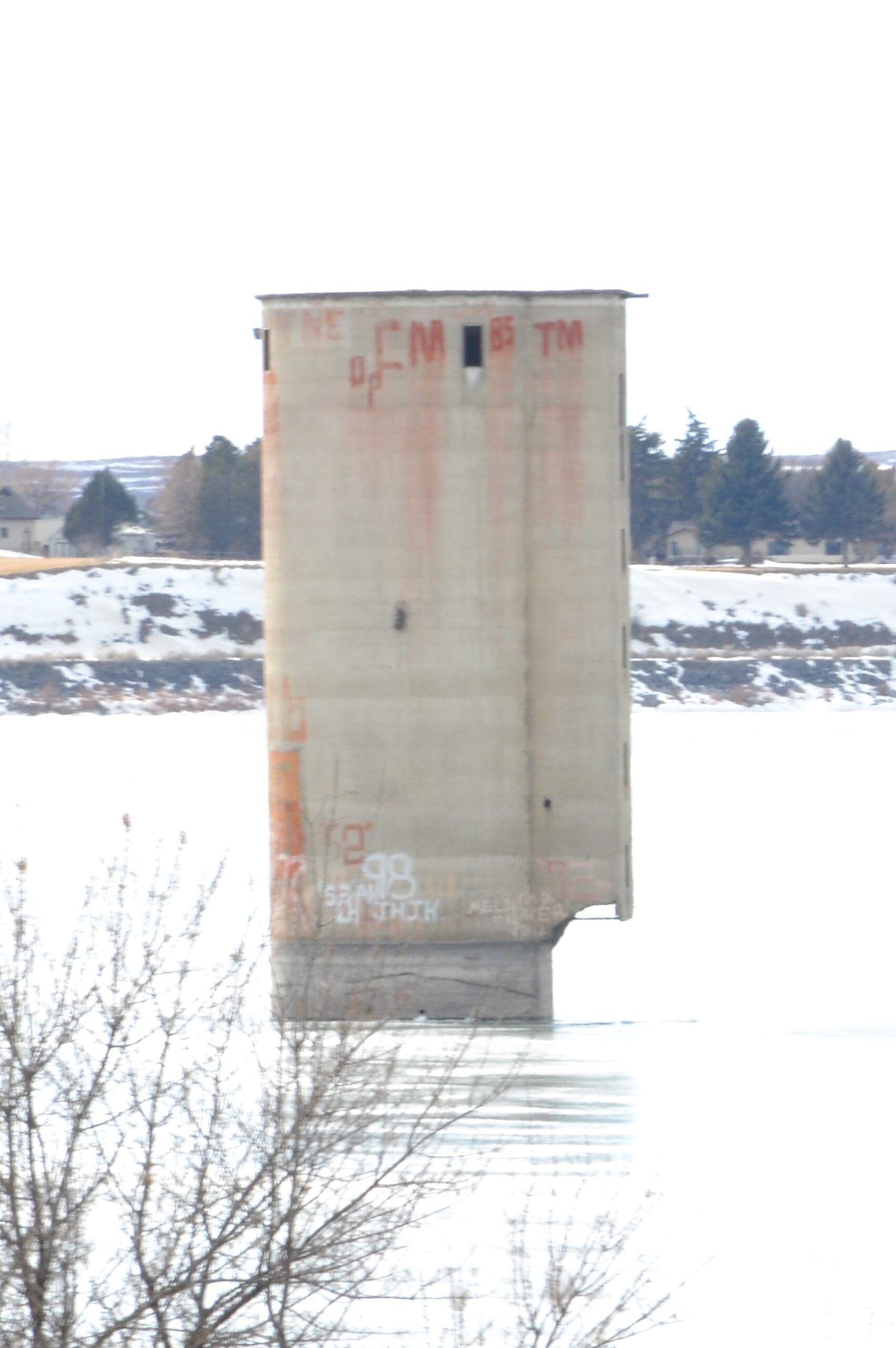 The Oneida Milling and Elevator Company grain elevator standing in American Falls Reservoir on the drowned Old American Falls townsite.